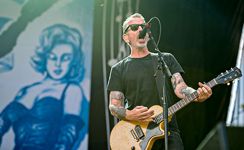 Social Distortion's Jonny Wickersham performs on stage during the Shaky Knees Music Festival at Central Park in Atlanta on Saturday, May 9, 2015. 