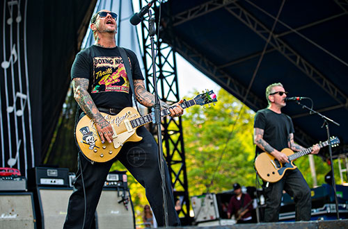Social Distortion's Mike Ness (left) and Jonny Wickersham perform on stage during the Shaky Knees Music Festival at Central Park in Atlanta on Saturday, May 9, 2015. 