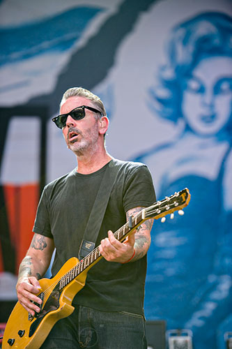 Social Distortion's Jonny Wickersham performs on stage during the Shaky Knees Music Festival at Central Park in Atlanta on Saturday, May 9, 2015. 