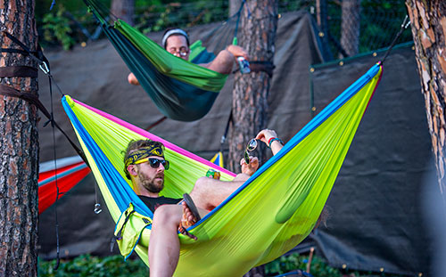 Colby Marshall (left) sits in a hammock with Sarah Fodge during the Shaky Knees Music Festival at Central Park in Atlanta on Saturday, May 9, 2015.