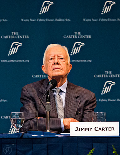 Former U.S. President Jimmy Carter listens to speakers give suggestions on how to end sexual exploitation during the inaugural World Summit to End Sexual Exploitation at the Carter Center in Atlanta on Tuesday, May 12, 2015.    
