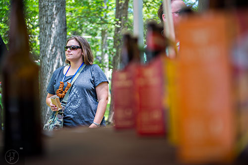Amanda Jalutkewicz decides which beer to try next during the East Atlanta Beer Fest at Brownwood Park on Saturday, May 16, 2015.