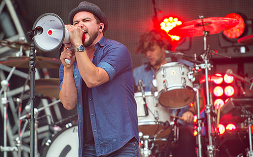 The Eli Young Band's Mike Eli uses a bullhorn as he performs during the Shaky Boots Music Festival at Kennesaw State University on Sunday, May 17, 2015. 