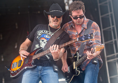 Judd Fuller (left) and Liam Bailey perform with Rodney Atkins during the Shaky Boots Music Festival at Kennesaw State University on Sunday, May 17, 2015.