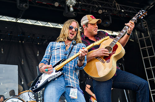 Rodney Atkins (right) and Phil Shouse perform during the Shaky Boots Music Festival at Kennesaw State University on Sunday, May 17, 2015. 