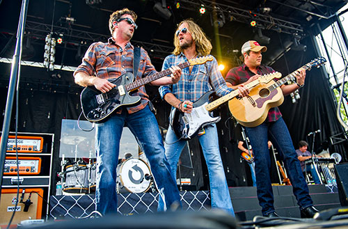 Liam Bailey (left), Phil Shouse and Rodney Atkins perform during the Shaky Boots Music Festival at Kennesaw State University on Sunday, May 17, 2015. 