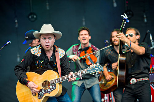 Old Crow Medicine Show's Critter Fuqua (left) performs during the Shaky Boots Music Festival at Kennesaw State University on Sunday, May 17, 2015. 