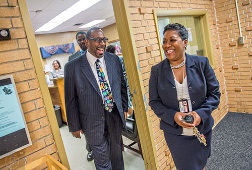 Dr. Stephen Green (left), the new superintendent for Dekalb County schools, talks with principal Dr. Audrey Brooks as they start his tour of Hambrick Elementary School in Stone Mountain on Wednesday, May 20, 2015. 