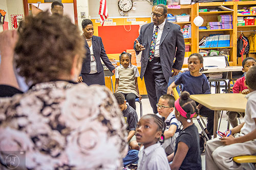 Dr. Stephen Green (center), the new superintendent for Dekalb County schools, sits in on a poetry lesson while touring Hambrick Elementary School in Stone Mountain on Wednesday, May 20, 2015. 