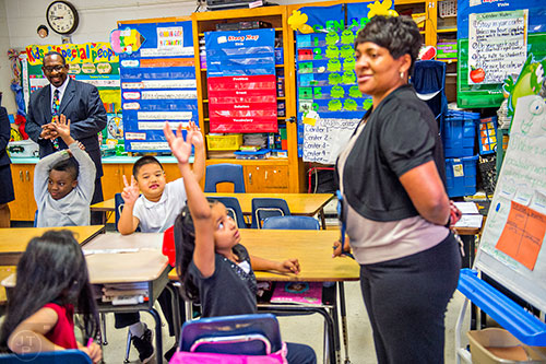 Dr. Stephen Green (left), the new superintendent for Dekalb County schools, sits in on a classroom discussion as he tours Hambrick Elementary School in Stone Mountain on Wednesday, May 20, 2015. 
