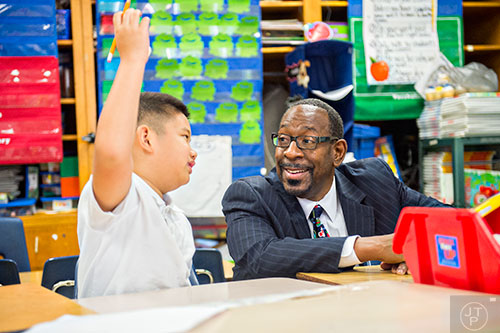 Dr. Stephen Green (right), the new superintendent for Dekalb County schools, talks with Alexander Nguyen as he tours Hambrick Elementary School in Stone Mountain on Wednesday, May 20, 2015. 