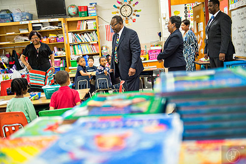Dr. Stephen Green (center), the new superintendent for Dekalb County schools, walks into Sandra Goodman's classroom as he tours Hambrick Elementary School in Stone Mountain on Wednesday, May 20, 2015. 