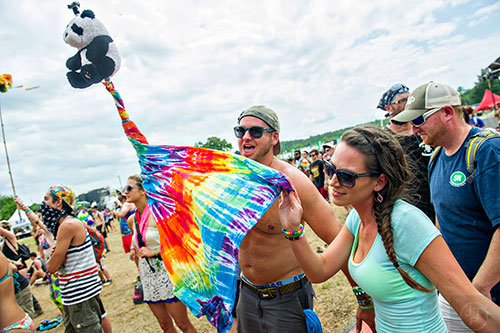 Brittany Switlick (right) and Adam Rabreau dance as Robert DeLong performs during the CounterPoint Festival at Kingston Downs in Rome on Sunday, May 24, 2015. 
