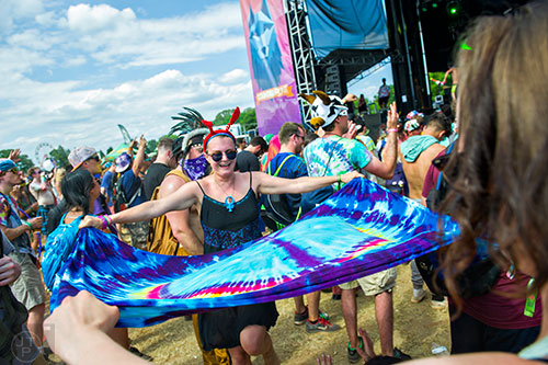 Julie Kacher (center) dances with a tie dyed sheet during the CounterPoint Festival at Kingston Downs in Rome on Sunday, May 24, 2015. 