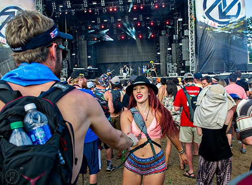 Chenoa Spangler (center) dances with Angus McTeer as The Roots perform during the CounterPoint Festival at Kingston Downs in Rome on Sunday, May 24, 2015. 