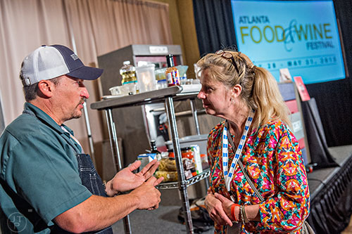 Chef Chris Lilly (left) speaks with Mary Lehner after finishing his demonstration during the Atlanta Food & Wine Festival at Loews Atlanta Hotel in Midtown on Saturday, May 30, 2015.