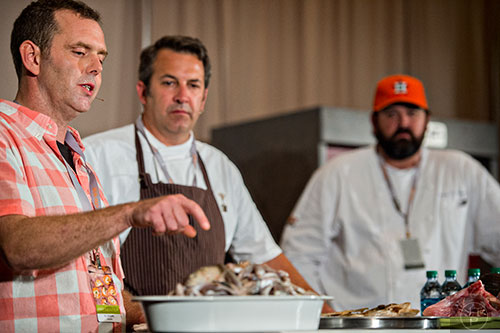 PJ Stoops (left), and chefs Kevin Johnson and Bryan Caswell talk about what was once considered worthless fish during Trash Fish: A Chef's Treasure demonstration at the Atlanta Food & Wine Festival at Loews Atlanta Hotel in Midtown on Saturday, May 30, 2015.