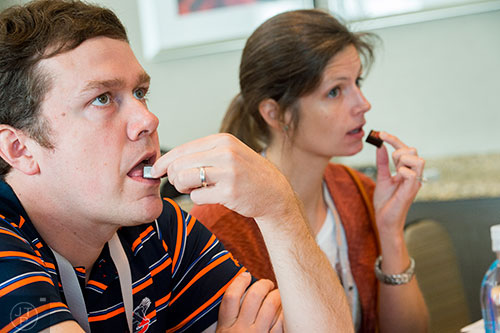 Jason Ham (left) and his wife Leslie try chocolates infused with crushed grasshopper while sitting in on the Bugs & Chocolate demonstration during the Atlanta Food & Wine Festival at Loews Atlanta Hotel in Midtown on Saturday, May 30, 2015. 