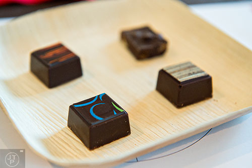 Chocolates, created by Nicole Patel, include ingredients such as meal worms (bottom), grasshopper (left) and crickets (right two) in the Bugs & Chocolate demonstration during the Atlanta Food & Wine Festival at Loews Atlanta Hotel in Midtown on Saturday, May 30, 2015. 