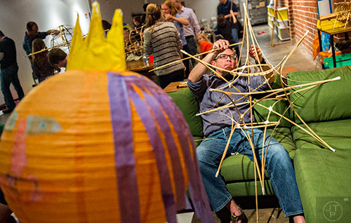 Russ Pierce constructs a bamboo lantern during a workshop at Color Wheel Studio in Decatur on Friday, April 24, 2015. 