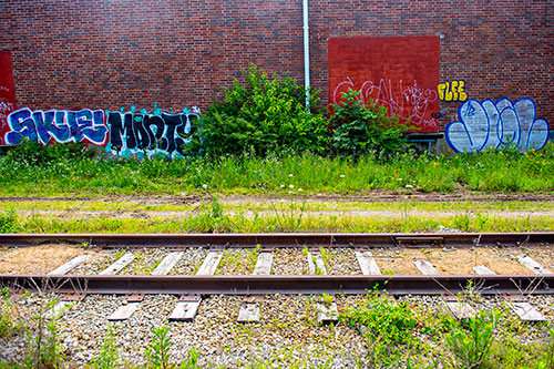 Graffiti marks the walls of a building along a section of yet to be developed Atlanta Beltline Trail on Friday, May 29, 2015.