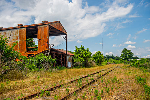 A abandoned and dilapidated building near a section of yet to be developed Atlanta Beltline Trail on Friday, May 29, 2015.
