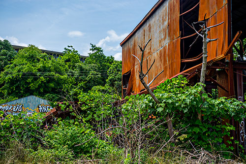 A abandoned and dilapidated building near a section of yet to be developed Atlanta Beltline Trail on Friday, May 29, 2015.