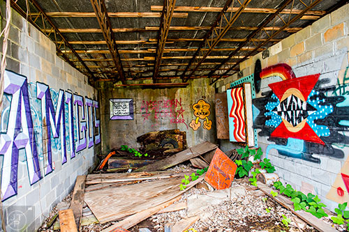 Graffiti marks walls of a group of abandoned garages near a section of yet to be developed Atlanta Beltline Trail on Friday, May 29, 2015.