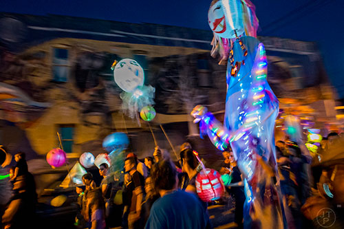 Lanterns make their way down N. Candler St. during the Decatur Lantern Parade on Friday, May 15, 2015.