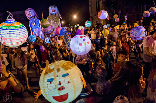 Lanterns and people fill the streets as people march in the Decatur Lantern Parade on Friday, May 15, 2015.