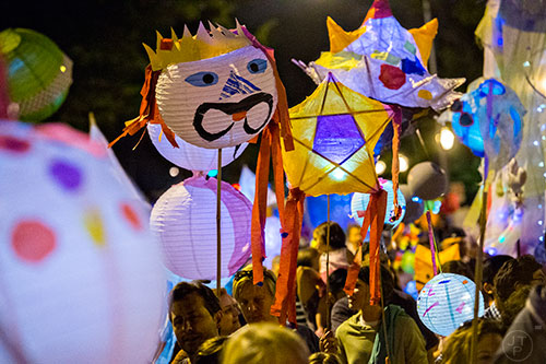 Lanterns and people fill the streets as people march in the Decatur Lantern Parade on Friday, May 15, 2015.