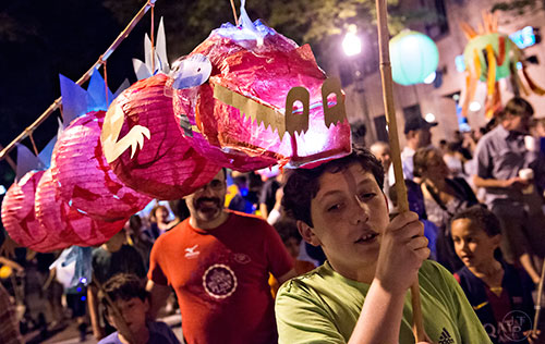 Ian Hogben (right) carries a dragon lantern with his brother Alec during the Decatur Lantern Parade on Friday, May 15, 2015. 