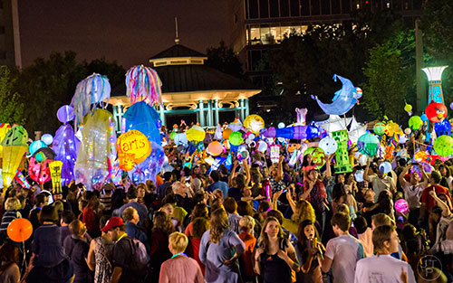 Thousands of people listen to the Black Sheep Ensemble play in Decatur Square at the conclusion of the Decatur Lantern Parade on Friday, May 15, 2015. 