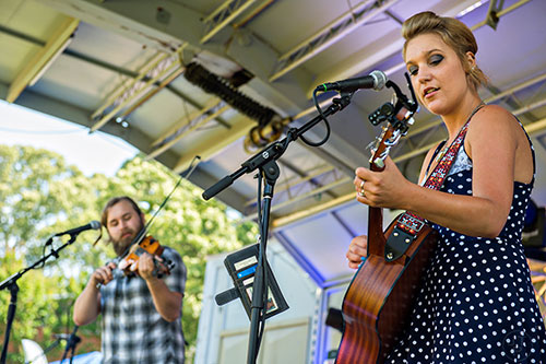 Stephanie Caron (right) and Evan Hart perform on stage during the Kirkwood Spring Fling at Bessie Branham Park on Saturday, May 16, 2015.