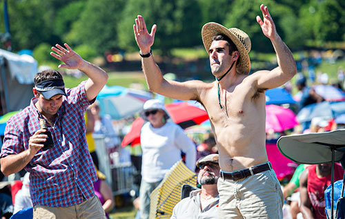 Mike Ceci (right) and Paul Bell dance as bands perform during the Atlanta Jazz Fest at Piedmont Park on Saturday, May 23, 2015.
