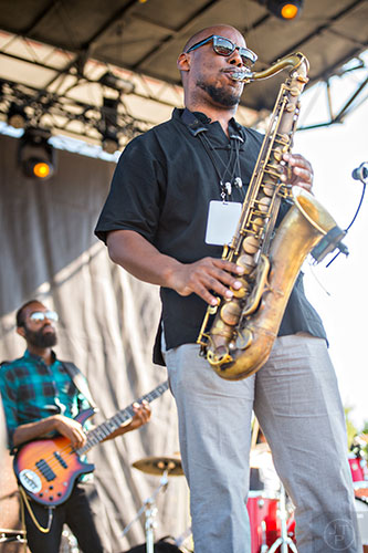 Marcus Strickland (right) and Kyle Miles perform on stage during the Atlanta Jazz Fest at Piedmont Park on Saturday, May 23, 2015.