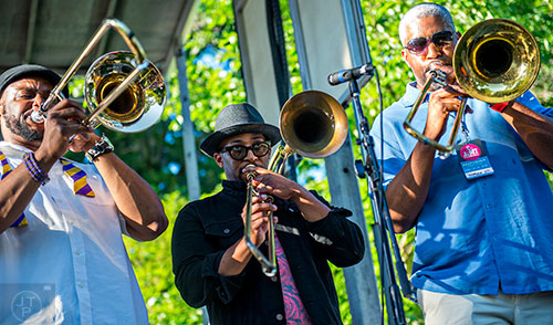 Members of Wolfpack ATL perform on stage with Kebbi Williams during the Atlanta Jazz Fest at Piedmont Park on Saturday, May 23, 2015.