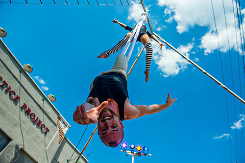 Jake Guinn and Nicolette Emanuelle perform on a set of silks during the Fire in the Fourth Festival in the Old Fourth Ward neighborhood of Atlanta on Saturday, May 2, 2015. 