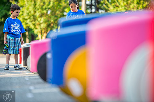 Daniel Susca (let) and Noa Lazarian inspect their cars before the start of the All American Dunwoody Soap Box Derby at the First Baptist Church of Atlanta in Dunwoody on Saturday, June 6, 2015. 