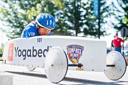 Toland Oakhill speeds down her lane during the All American Dunwoody Soap Box Derby at the First Baptist Church of Atlanta in Dunwoody on Saturday, June 6, 2015. 