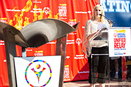 Georgia Sheats, the CEO of Special Olympics Georgia, speaks to the crowd gathered at Turner Field in Atlanta after the torch for the Unified Relay Across America is brought in and the cauldron lit on Saturday, June 6, 2015. 