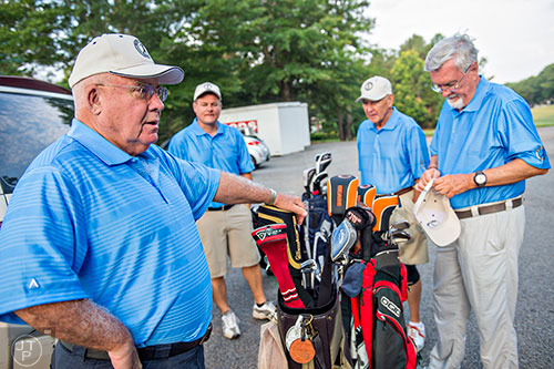 Bobby Jones (left), Chester Arter, Bobby Jones and Bobby Jones grab their golf clubs for the start of the Bobby Jones Open golf tournament at Braelinn Golf Club in Peachtree City on Tuesday, June 9, 2015. 