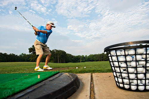 Bobby "Coach" Jones from Danville, VA warms up on the driving range before the start of the Bobby Jones Open golf tournament at Braelinn Golf Club in Peachtree City on Tuesday, June 9, 2015. 