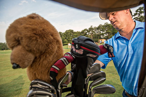 Bobby "Bugs" Jones (right) from Redding, PN grabs his clubs to warm up before competing in the Bobby Jones Open golf tournament at Braelinn Golf Club in Peachtree City on Tuesday, June 9, 2015. 