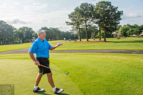 Bobby "Holly" Jones from Holly, MI catches a golf ball after warming up for the Bobby Jones Open golf tournament at Braelinn Golf Club in Peachtree City on Tuesday, June 9, 2015. 