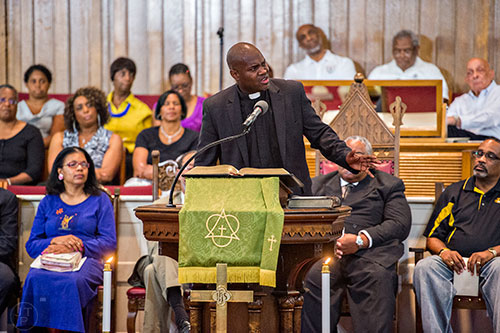 Rev. Bobby Graham (center) speaks during the Prayer, Healing and Reconciliation Service for members of the Emanuel A.M.E. Church in Charleston, South Carolina who lost their lives earlier this week at Big Bethel A.M.E. Church in Atlanta on Friday, June 19, 2015. 