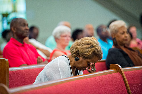 Jacqueline Hoffman holds her head in her hand during the Prayer, Healing and Reconciliation Service for members of the Emanuel A.M.E. Church in Charleston, South Carolina who lost their lives earlier this week at Big Bethel A.M.E. Church in Atlanta on Friday, June 19, 2015.  