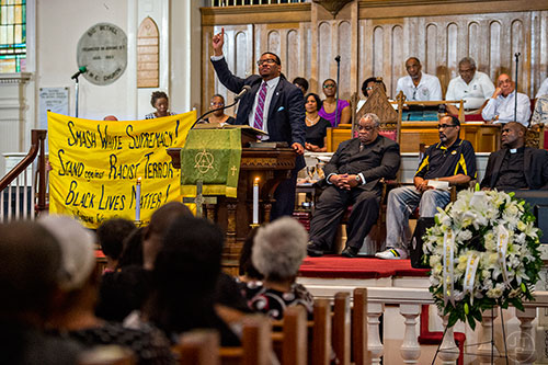 Georgia NAACP President Rev. Dr. Francis Johnson (center) speaks during the Prayer, Healing and Reconciliation Service for members of the Emanuel A.M.E. Church in Charleston, South Carolina who lost their lives earlier this week at Big Bethel A.M.E. Church in Atlanta on Friday, June 19, 2015. 