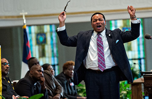 Georgia NAACP President Rev. Dr. Francis Johnson (right) speaks during the Prayer, Healing and Reconciliation Service for members of the Emanuel A.M.E. Church in Charleston, South Carolina who lost their lives earlier this week at Big Bethel A.M.E. Church in Atlanta on Friday, June 19, 2015. 