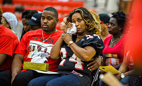 Latoscha Brown (center), mother of Wali Clanton Jr., wipes tears from her eyes during the memorial service for her son at Dutchtown High School in Hampton on Thursday, June 18, 2015. 